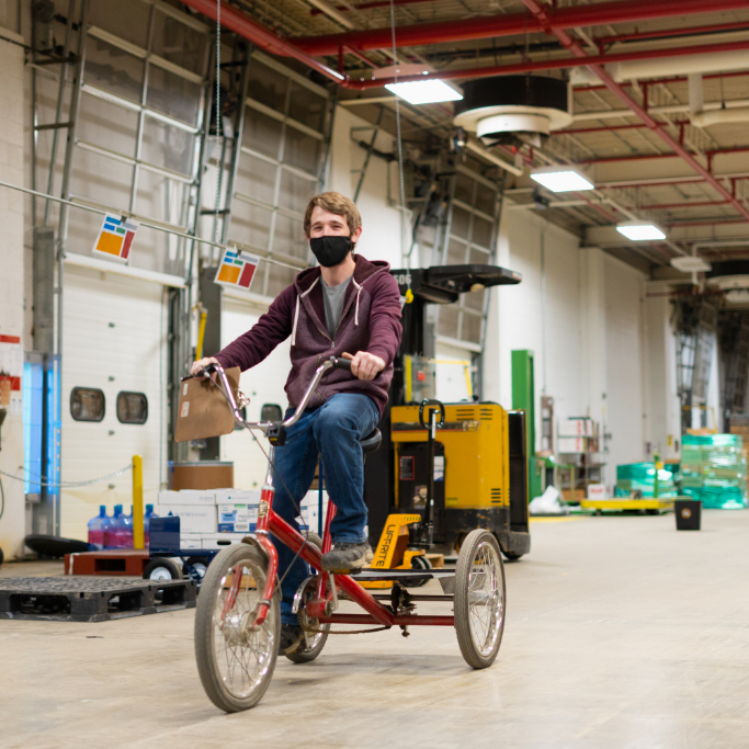 Abraxas team member riding a bike