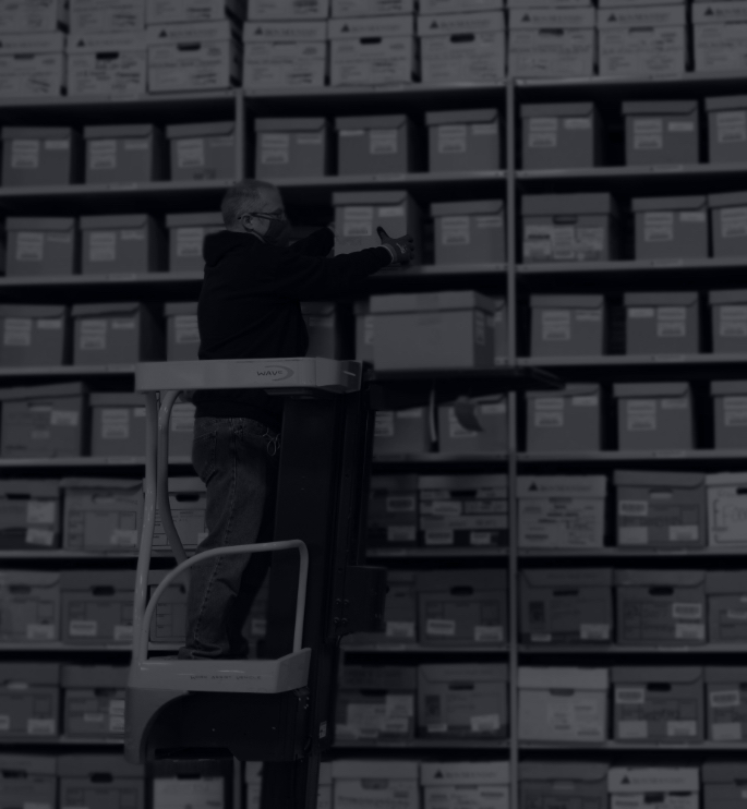 man working in a document Storage & Retrieval warehouse